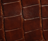 dark chocolate alligator-textured leather