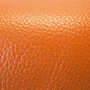 orange pebble-textured cowhide leather swatch