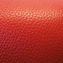 swatch of red pebble-textured cowhide leather